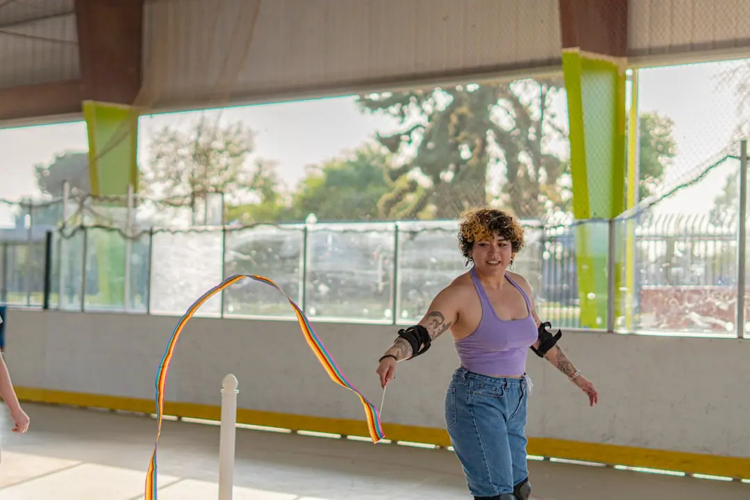 A woman skates with a ribbon.