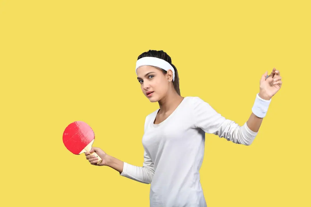 a woman holding a pink balloon